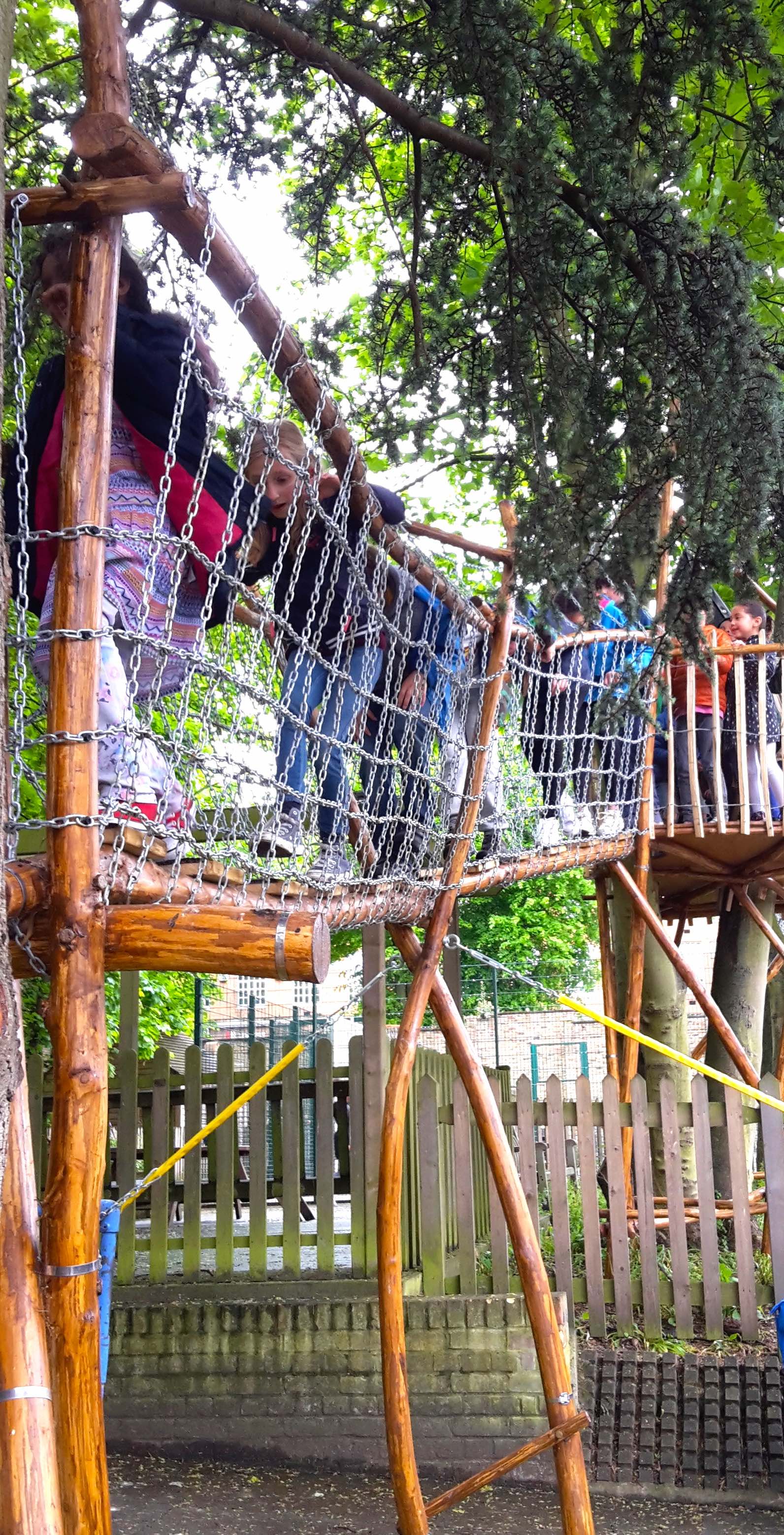 Close-up of timber posts, rope nets and joinery on a play structure